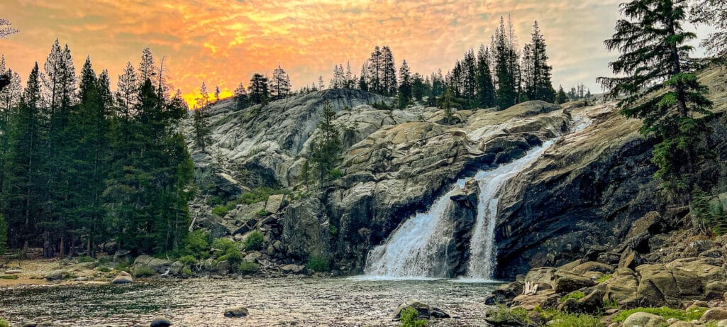 A beautiful sunset over the waterfall at Glen Aulin