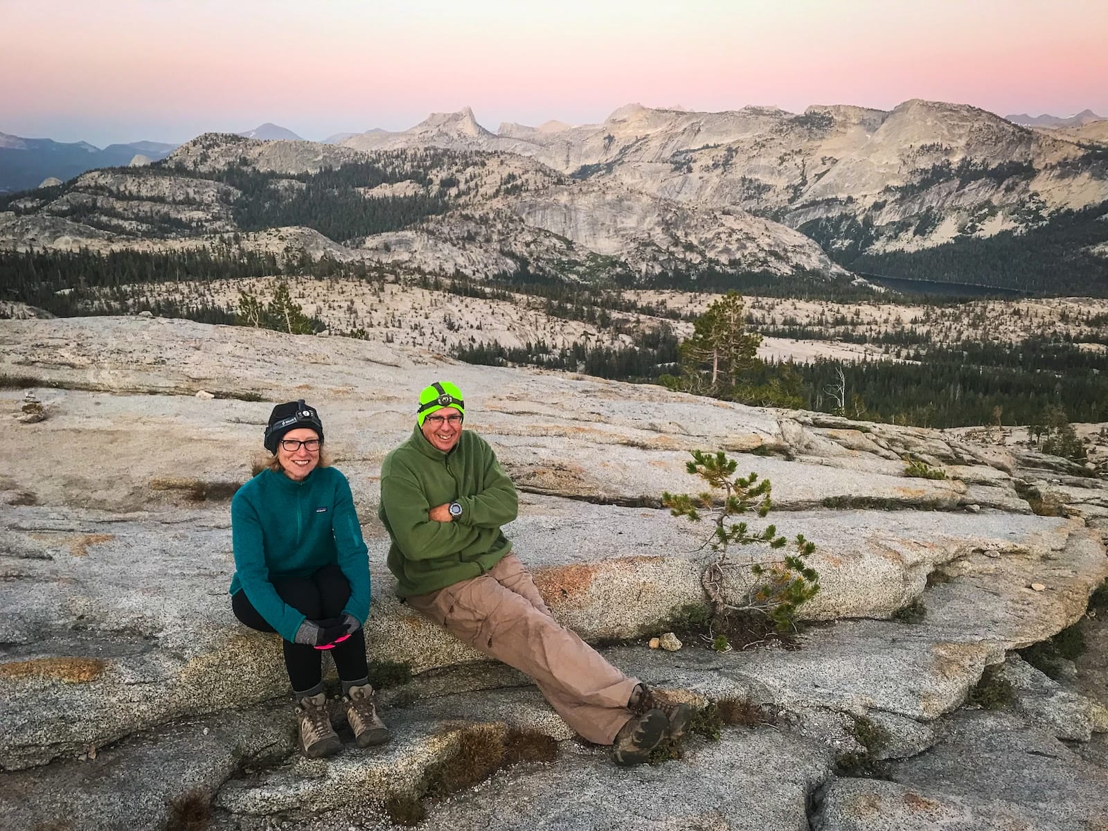 Couple watching sunset at May Lake