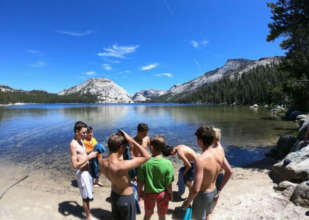 Yosemite Summer Camp participants relax by the lake