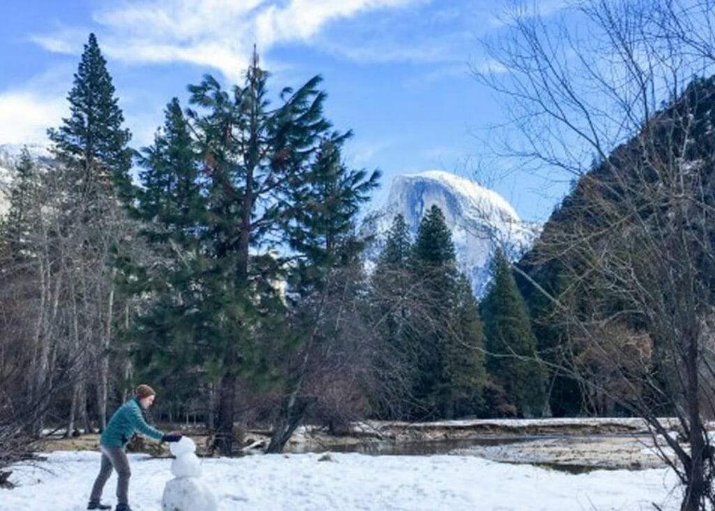 Building a snowman on our Yosemite winter backpacking snowshoe
