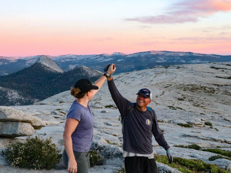 high fives at the summit of our Yosemite Glacier Point to Half Dome Trip