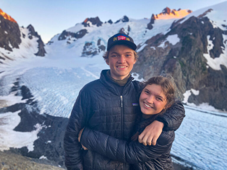 Brother and sister hugging in front of Blue Glacier