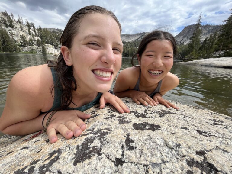 Girls smiling while swimming