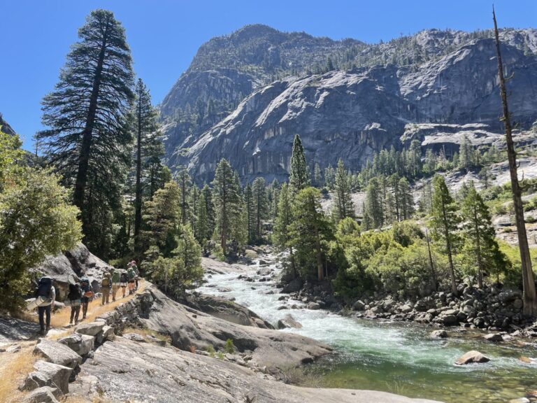 Kids backpacking by the Tuolumne River