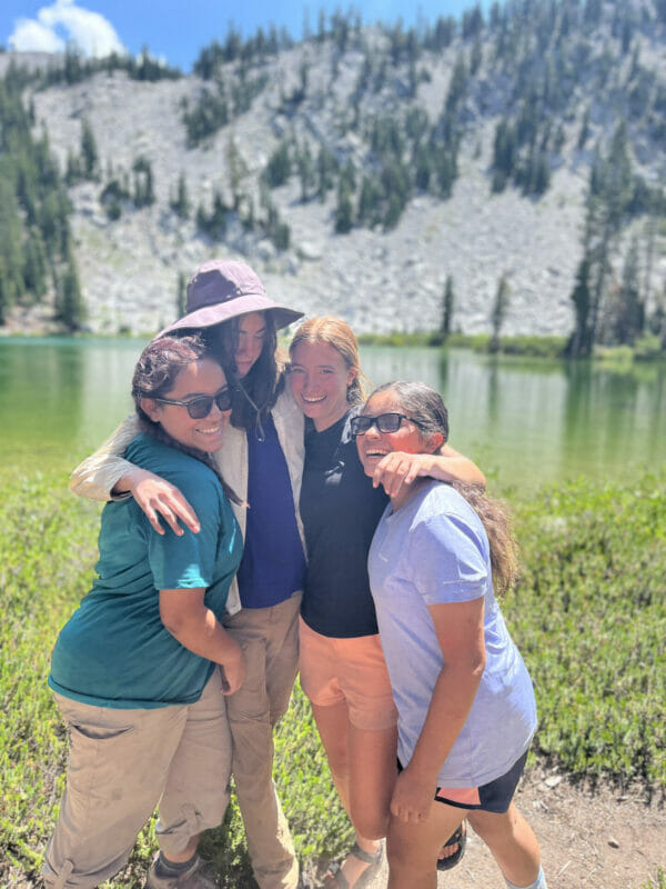 Girls bonding in front of one of the colorful lakes.