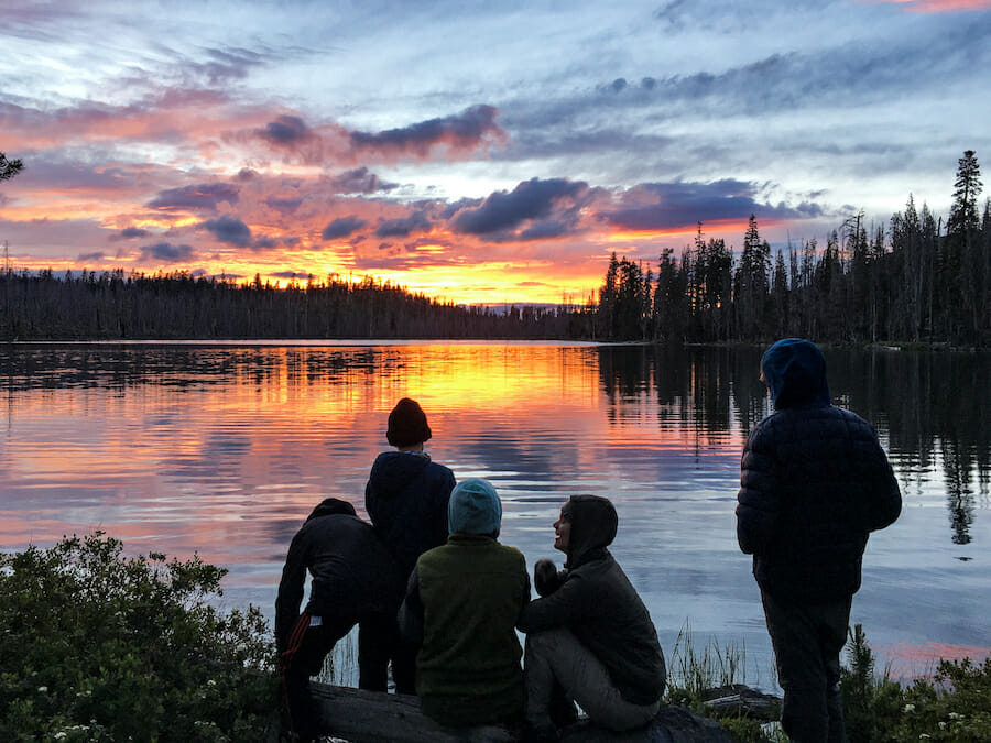 Watching the sunset at the lake at the end of the day.