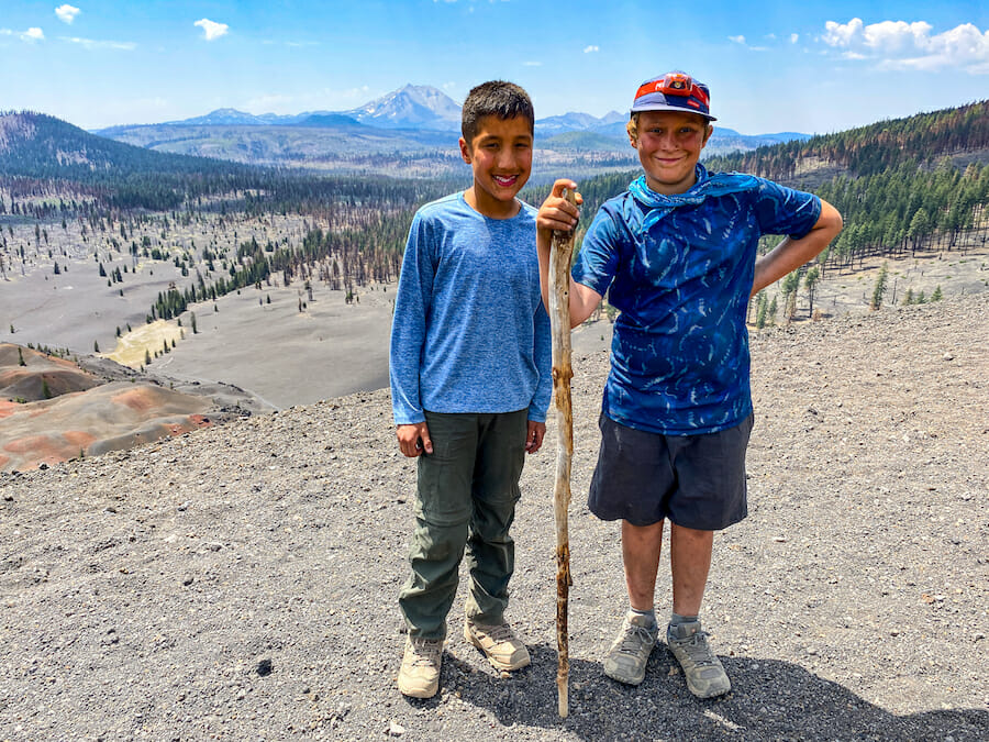 Young Adventurers posing in front of Lassen Peak.