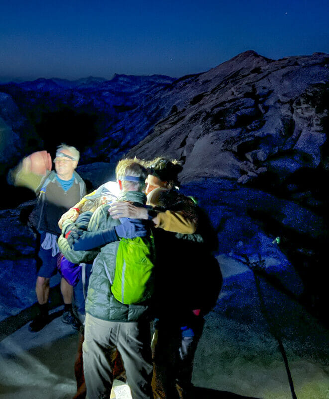 Group hugs after ascending Half Dome.