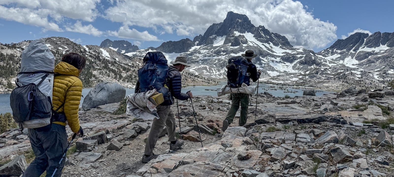 Teens backpacking toward Thousand Island Lake with Mt Banner in the background
