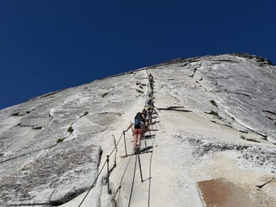 Teens ascending the Half Dome cables