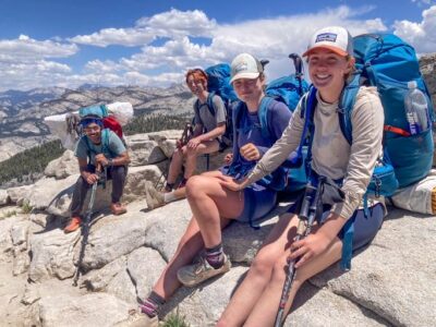 Backpackers taking a rest on rock