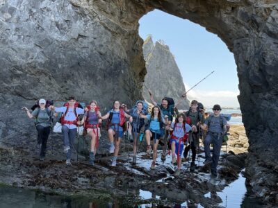 A group of teens backpacking at Hole in the Wall in Olympic National Park