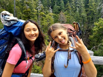 Two teen girls having fun backpacking in Olympic National Park