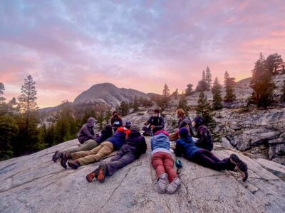Teens enjoying the sunset on one of our backpacking summer camps