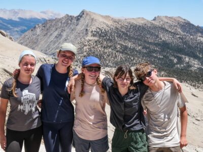 A group of teens backpacking in the mountains of Sequoia National Park