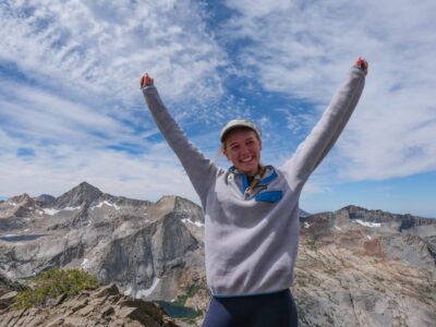 Girl with arms in the air backpacking in Sequoia National Park