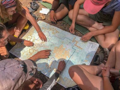 studying the map on one of our Adventure Summer Camps