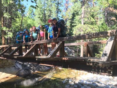 crossing the bridge on one of our girls summer camp adventures