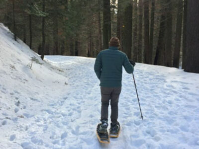 A client snowshoeing in Yosemite